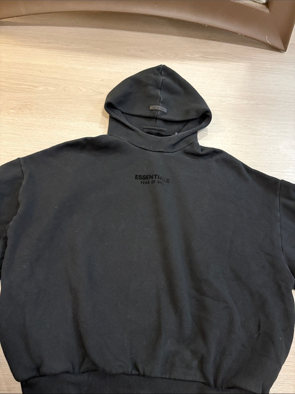 Essentials Black Pullover Hoodie with Subtle Chest Logo